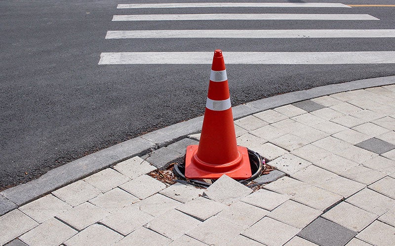 cone on a sidewalk